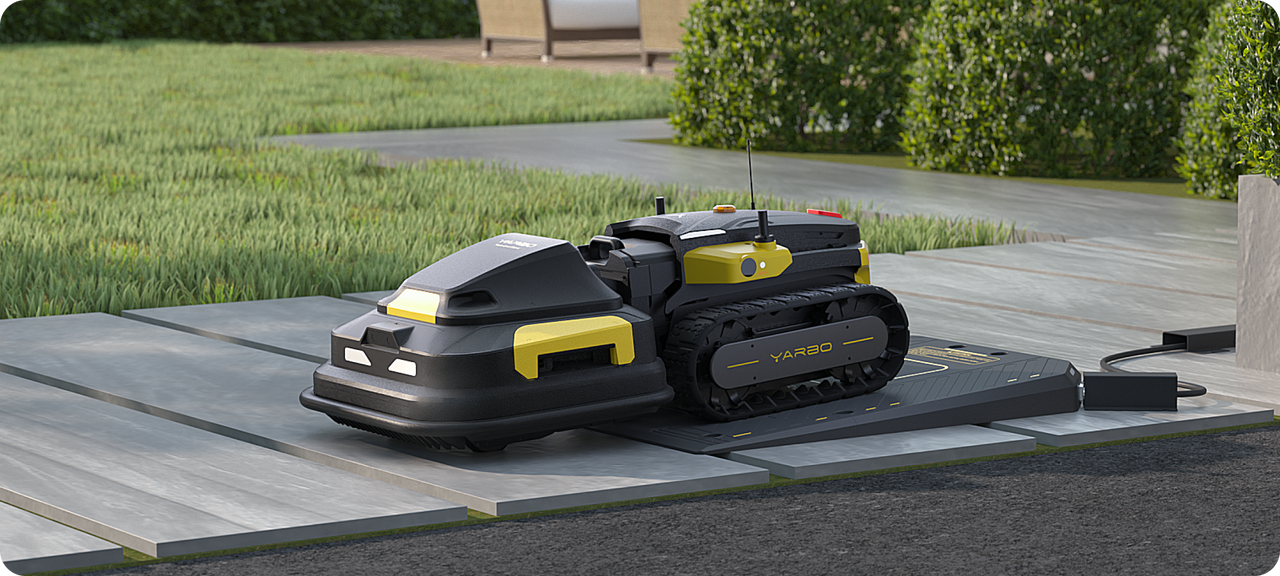 Yarbo lawn mower docking on its auto-recharging station, automatically returning at 20% battery and resuming mowing without user input