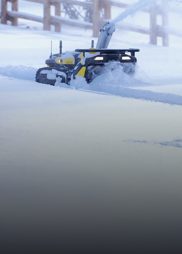 Yarbo robotic snow blower autonomously clearing a heavy snowfall driveway