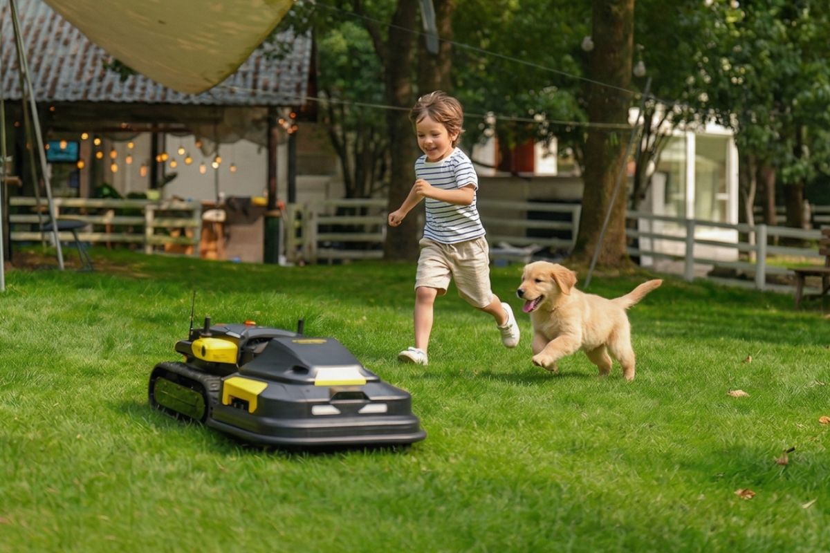 Child running with a dog near a Yarbo in a backyard