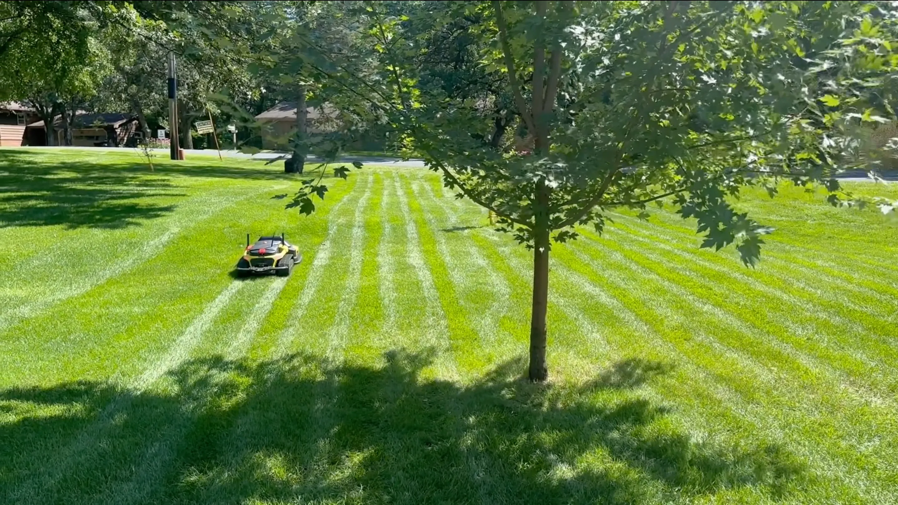 Multi-function autonomous mower on a manicured field