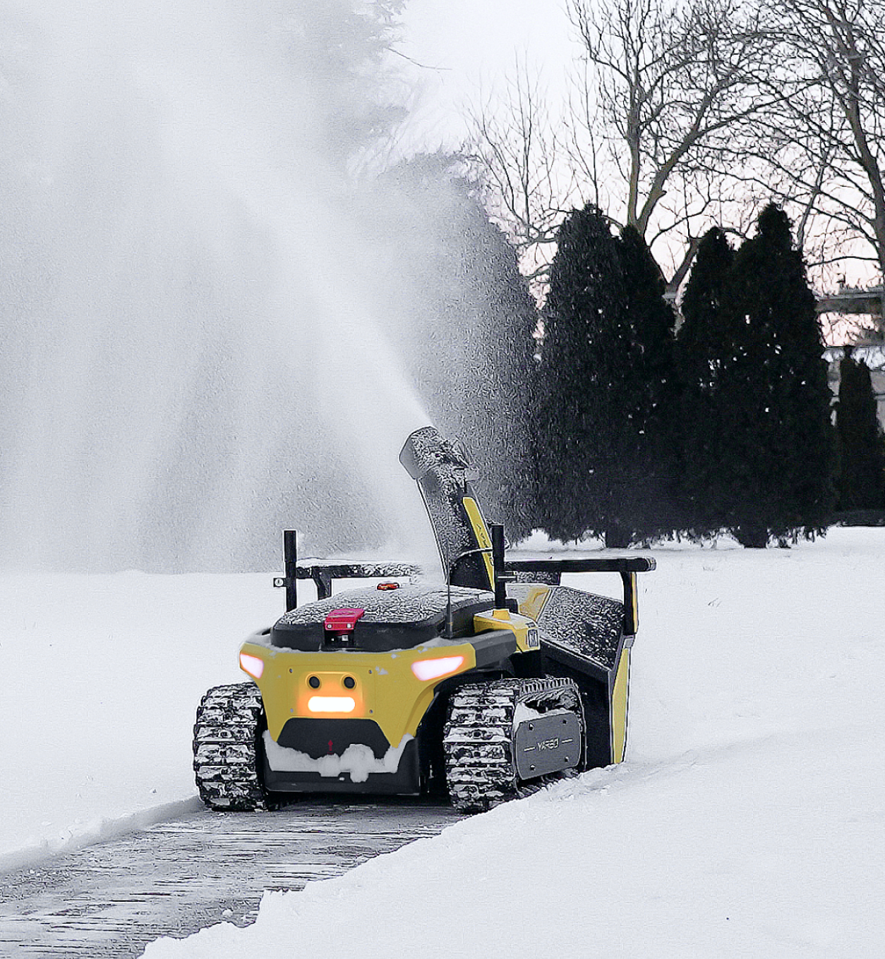 Yarbo snow blower throwing snow at high distance while autonomously clearing a residential driveway at dusk