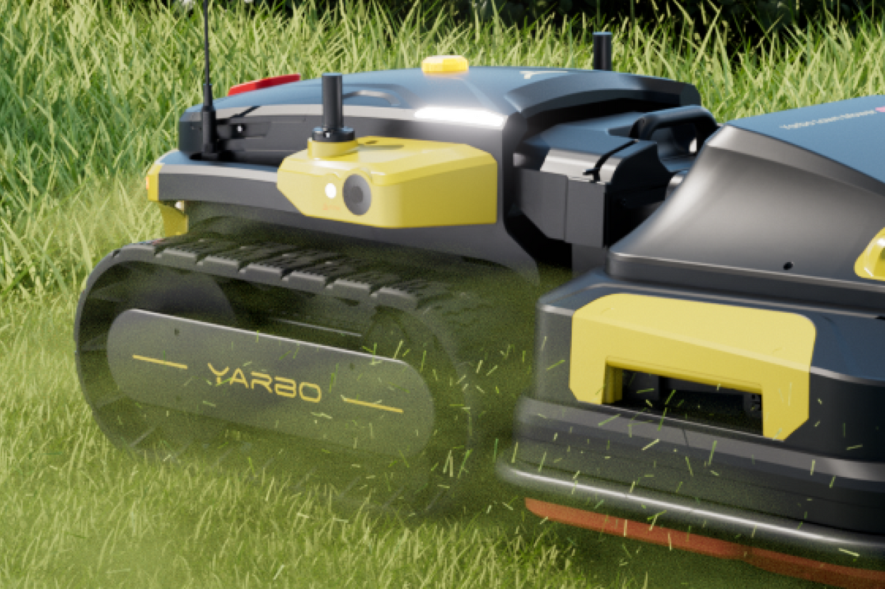 Yarbo Lawn Mower Pro track-driven base powering through dense grass with no clogging for consistent autonomous mowing