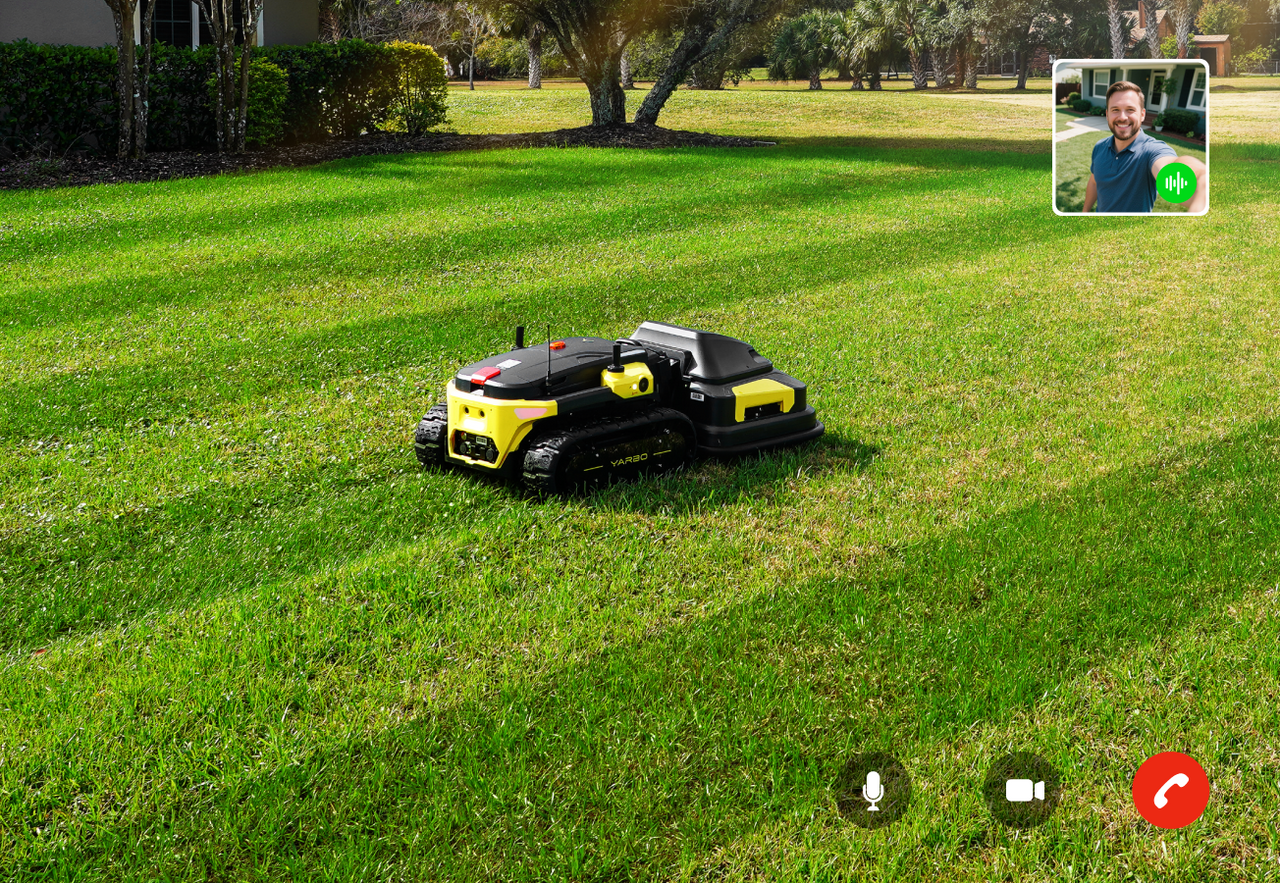 Yarbo lawn mower operating autonomously on a residential lawn with live video call support overlay, showing remote customer assistance