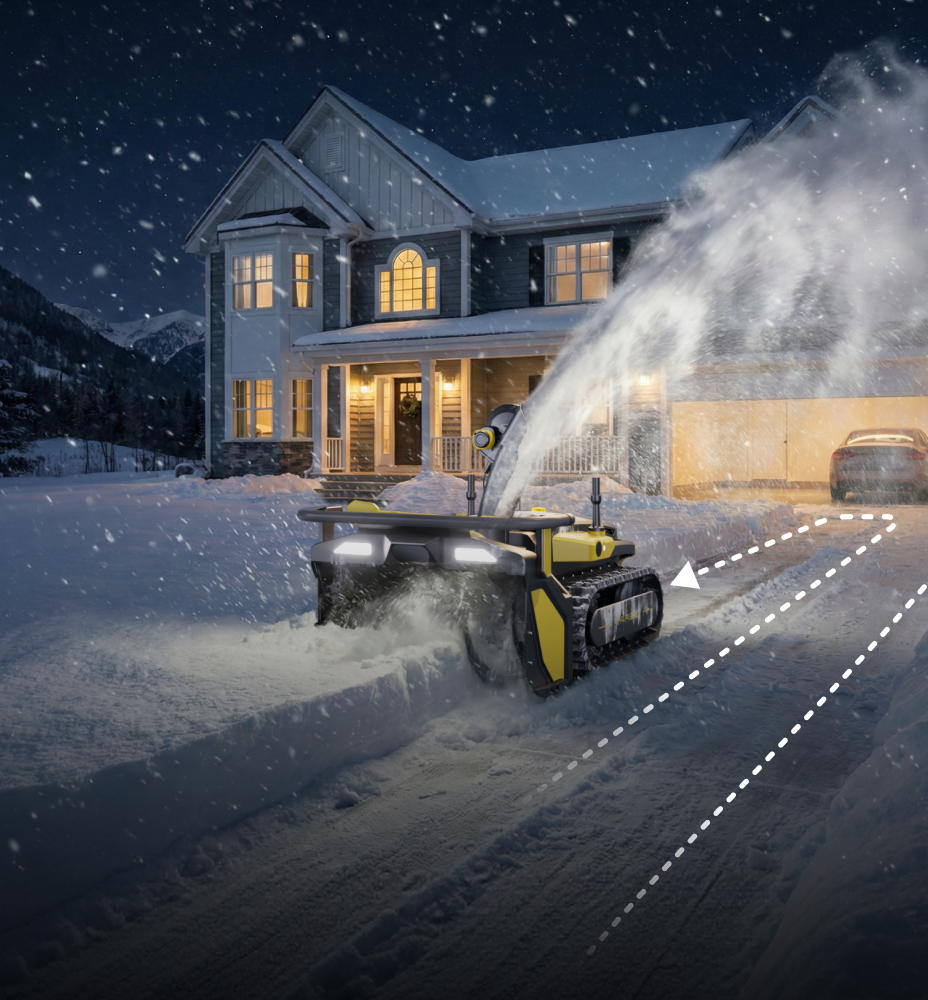 Yarbo snow blower following a custom scheduled clearing path along a residential driveway at night during heavy snowfall