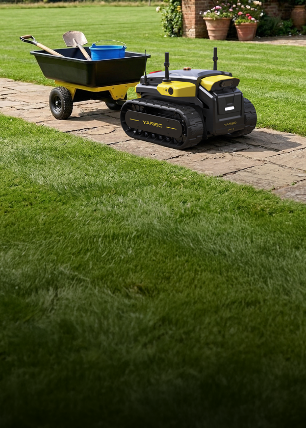Yarbo Core autonomous robot towing a garden cart with tools along a stone path