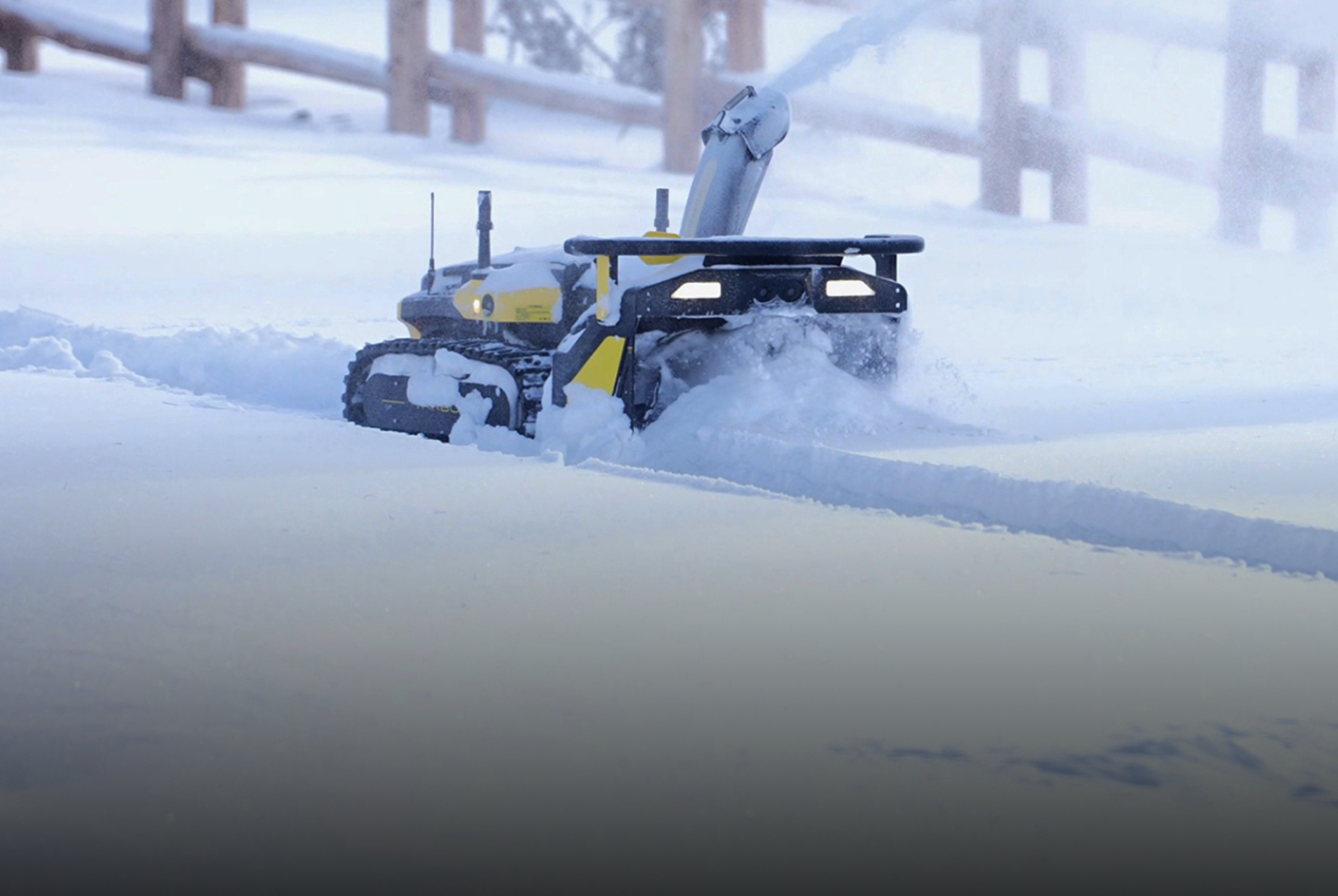 Yarbo robotic snow blower autonomously clearing a heavy snowfall driveway
